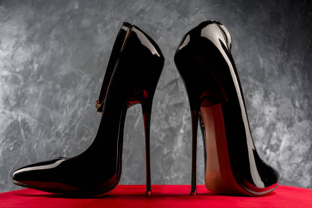 istock Black fetish shiny patent leather stiletto high heels with ankle strap 1216908085