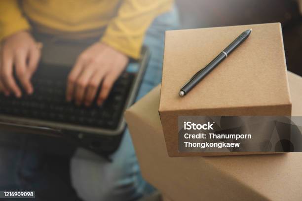 Young Woman Small Business Owner Working On Laptop Computer At Home Online Marketing Packaging And Delivery Scene Startup Sme Entrepreneur Or Freelance Womanworking At Home Concept Stock Photo - Download Image Now