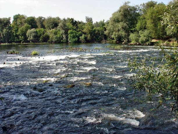 istock A wide, stormy river on a summer morning below the dam. 1216910187