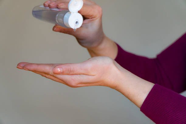 istock Woman hands use a gel, disinfectant, antiseptic in a bubble 1216910483