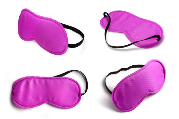 istock Collection of purple sleeping eye masks on white 1216910493