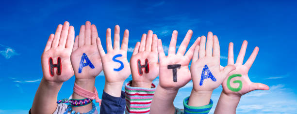 istock Children Hands Building Word Hashtag, Blue Sky 1216911820