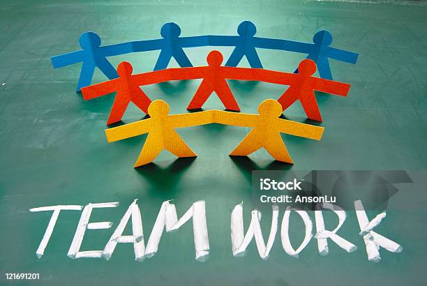 Teamwork Words And Colorful Paper Dolls Stock Photo - Download Image Now - Alphabet, Bonding, Business