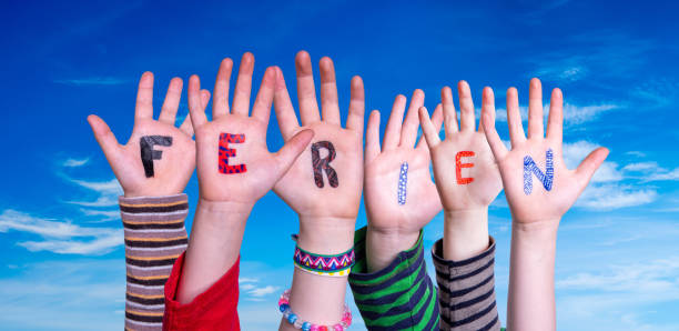 istock Children Hands Building Word Holidays Means Holidays, Blue Sky 1216912656