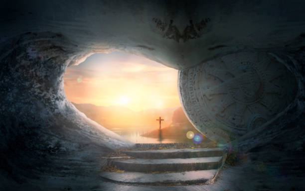 istock Easter Sunday concept: Tomb empty with cross on sunset background 1216913822