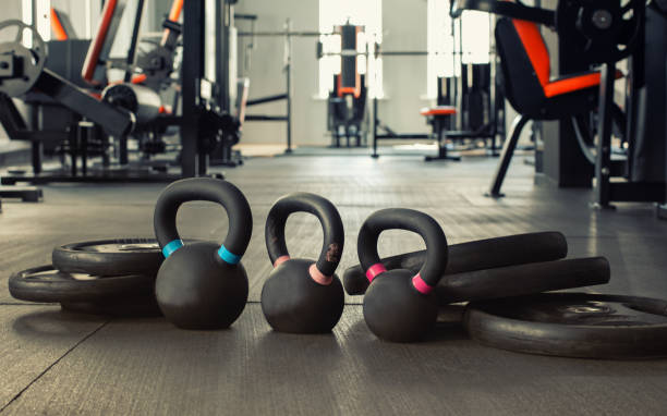 istock three black kettlebells with five black plates in the gym 1216914347