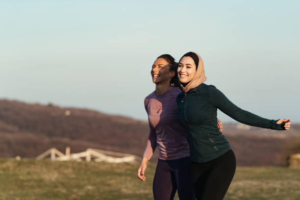 istock Young happy sportswomen having fun while running in nature. 1216915378