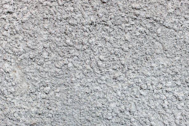 istock gray natural decorative plaster cement-based exterior wall. 1216915657