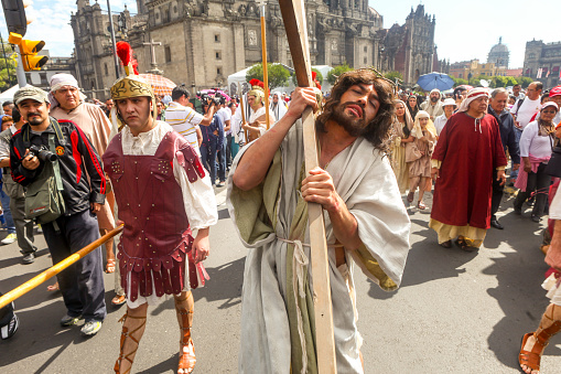 Mexico City, Mexico, Apr 06 - Public reenactment and representation with extras of the Catholic Via Crucis, with Passion and Death of Jesus Christ, in front of the Metropolitan Cathedral in the Zocalo of Mexico City, during the celebrations of Holy Week and Easter of Resurrection.