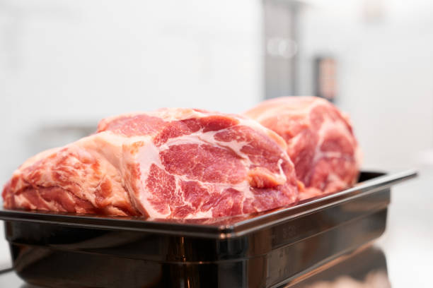 istock Raw meat in black bowl. 1216917622