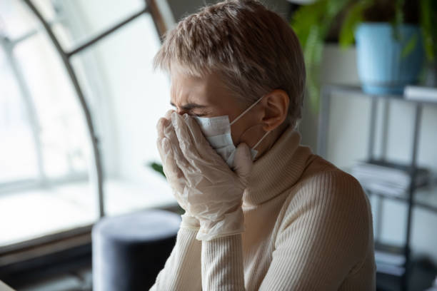 istock Stressed female employee got infected by coronavirus, suffering from symptoms. 1216917650