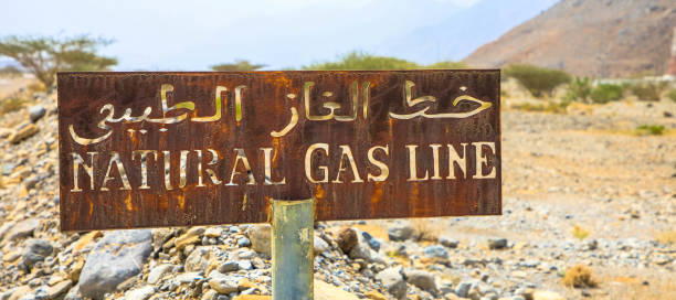 rusty sign, natural gas line in the desert