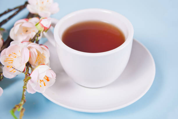 istock A cup of tea and cherry blooming with flowers sakura on the table. Spring concept. 1216920053