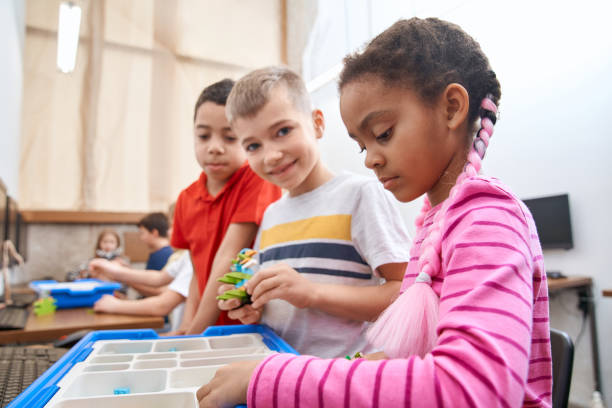 istock Kids using building kit to create toys. 1216920333