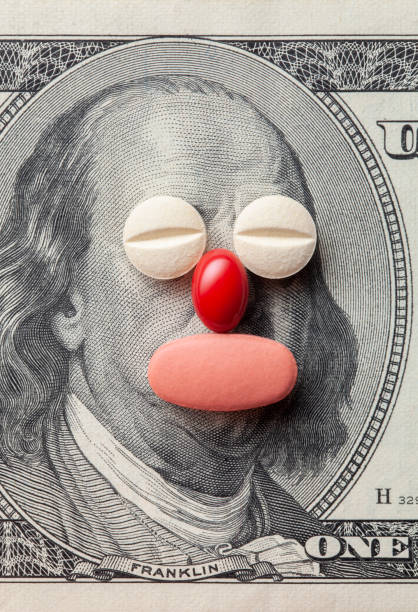 Cost of Healthcare. Pills on US dollars. Pills on US dollars. irony stock pictures, royalty-free photos & images