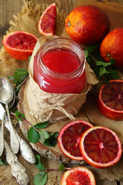 istock Still life with red oranges and lemons on a wooden background 1216922810