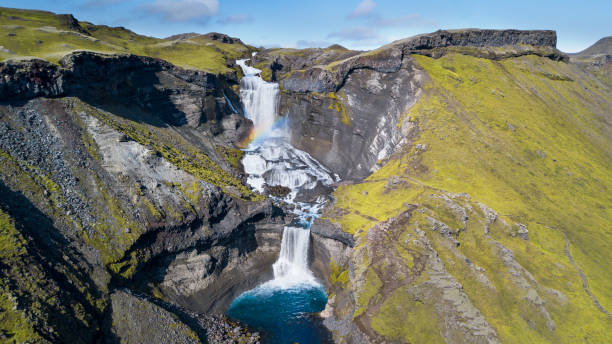 istock spray and waterfall in iceland 1216923195