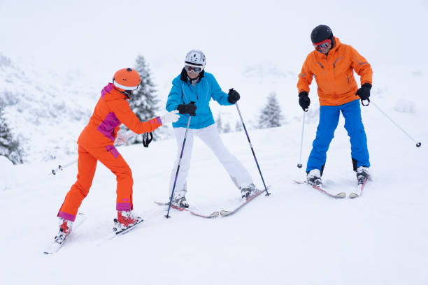 istock senior couple during skiing lesson 1216924049