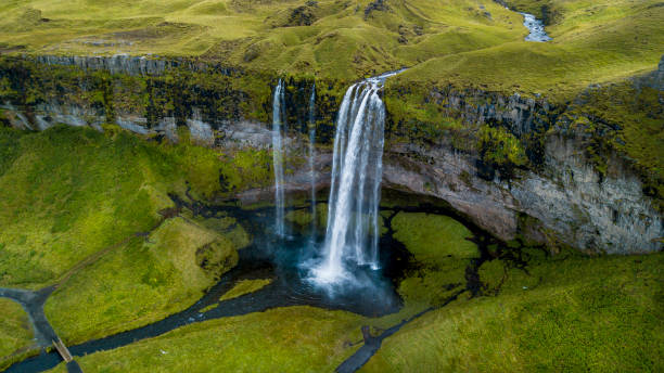 istock spray and waterfall in iceland 1216924063