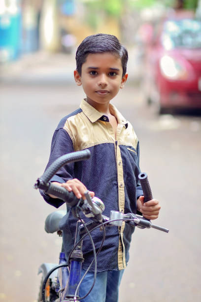 istock Indian little boy enjoying the cycle ride 1216924182