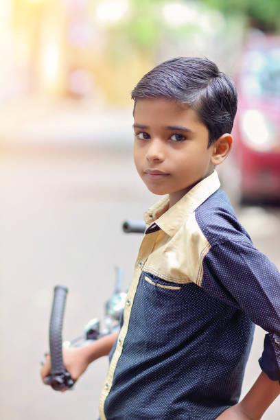 istock Indian little boy enjoying the cycle ride 1216924220