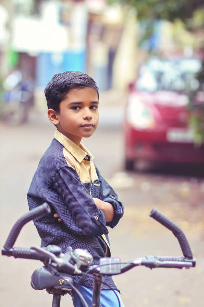 istock Indian little boy enjoying the cycle ride 1216924223