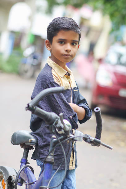 istock Indian little boy enjoying the cycle ride 1216924226