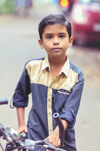 istock Indian little boy enjoying the cycle ride 1216924252