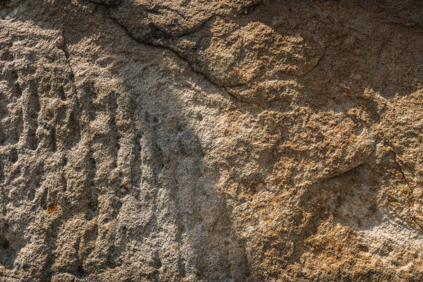 istock Yellow orange sandstone brick wall texture close up. 1216924387