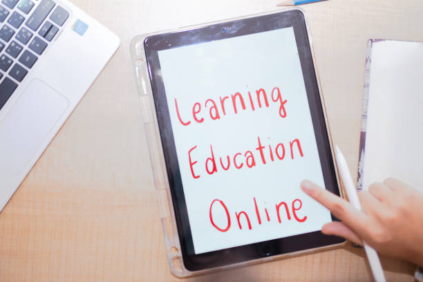 istock close up of student woman with chart on tablet pc computer and notebook at home 1216924550