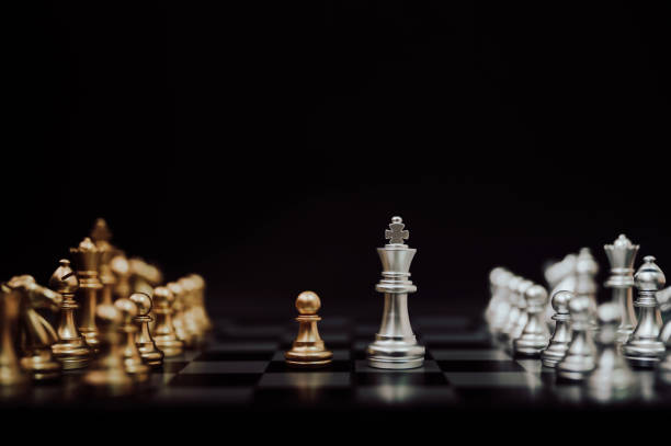 istock Business competition and strategy plan concept. Chess board game gold and silver colour 1216926619