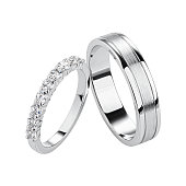 Pair of silver wedding rings isolated on white background.