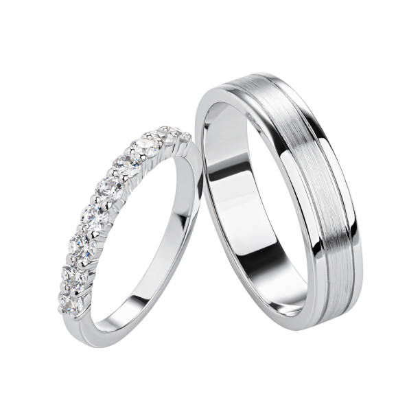 Pair of silver wedding rings isolated on white background. stock photo
