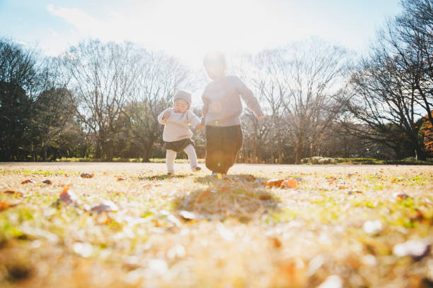 istock Boy help  baby girl walk 1216931671