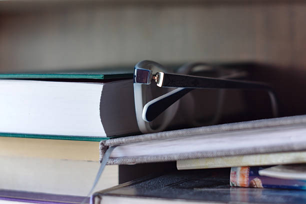 istock glasses among the books on the bookshelf 1216931865