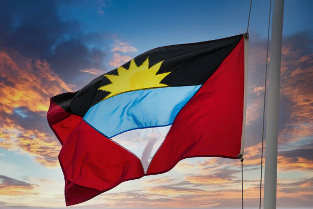istock Flag of Antigua on Sunset Sky 1216934800