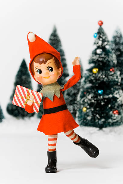 istock Vintage Christmas elf and miniature Christmas trees 121693528