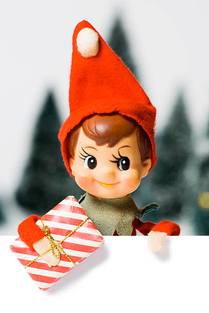 Small ornamental Christmas elf wearing red hat Vintage pixie elf Christmas tree ornament.  Made in Japan, circa 1950's. elf stock pictures, royalty-free photos & images