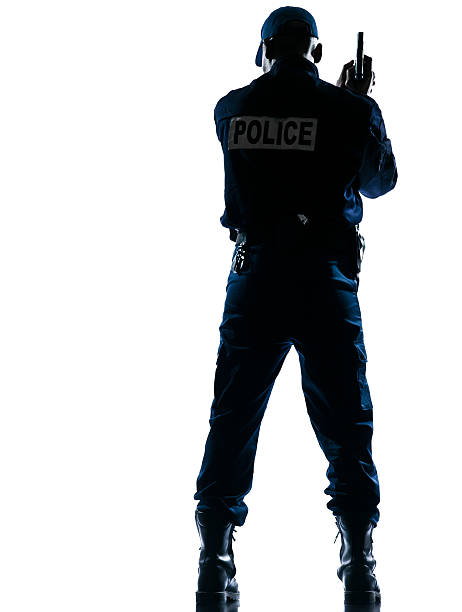 istock Rear view of policeman with handgun 121693682