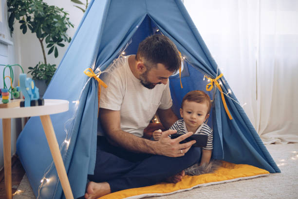istock Watching cartoons on mobile phone 1216938937