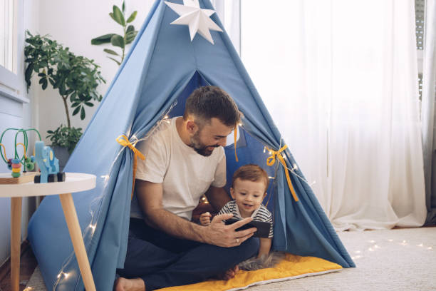 istock Watching cartoons on mobile phone 1216938995