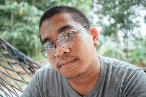 istock southeast asian man relaxing with nature 1216941933