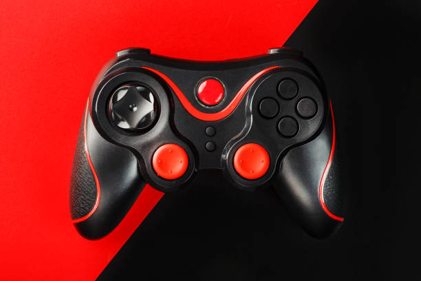 istock Black gamepad on a black red background, . Gaming concept. 1216943565