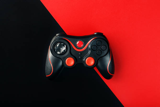 istock Black gamepad on a black red background, . Gaming concept. 1216944866