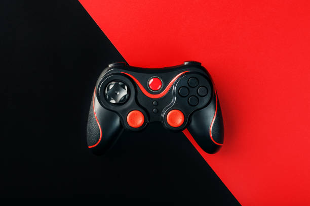 istock Black gamepad on a black red background, . Gaming concept. 1216944949
