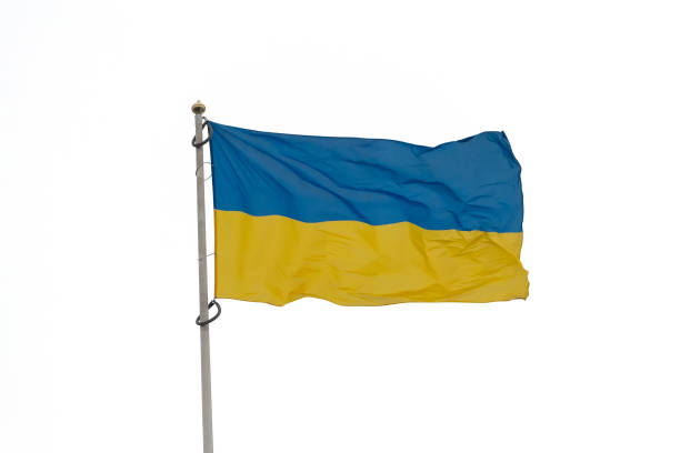 istock Ukrainian flag on the flag pole isolated on a white background 1216944971