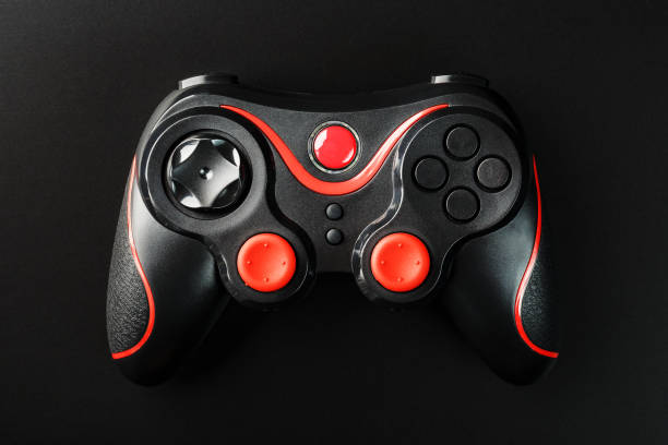istock Black Game controller gamepad on black background close Up . Device to control and control the game. 1216945002