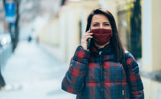 istock Woman with face protective mask 1216946078