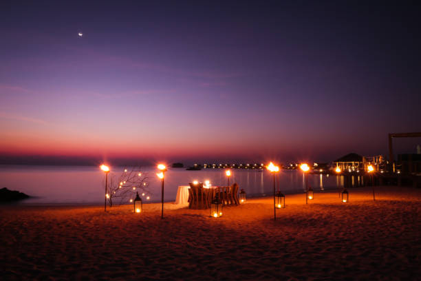 istock Romantic Maldivian Sunset Beach Dinner with candlelight 1216946132