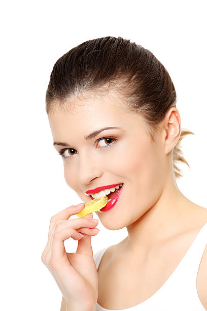 istock Young beautiful woman's eating sweets. 121694622